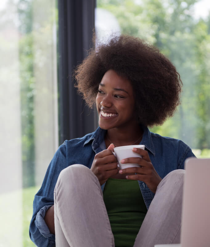 Woman enjoying a cup of coffee.